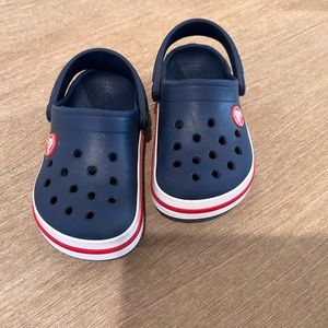 Toddler size 8 navy crocs. Used for one summer, in excellent condition.